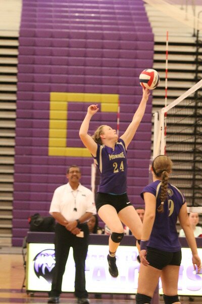 FALCONS TAKE FLIGHT: Senior Sarah McGrath serves a vicious strike against Kingsway on November 4, 2015, leading Monroe to victory 2-0. The girls became the first volleyball team in MTHS history to win the GMC Championship.