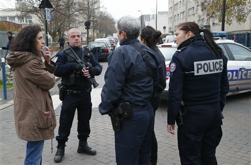 FRENCH TEACHER CLAIMS ASSAULT: Police officers control the area near a pre-school after a teacher claims that a masked assailant with a box-cutter and scissors who mentioned the Islamic State group attacked him on Monday, Dec.14, 2015 in Paris. 